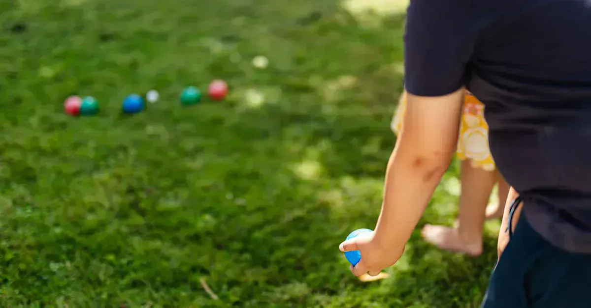 Bocce Ball set on a lawn, ready to play