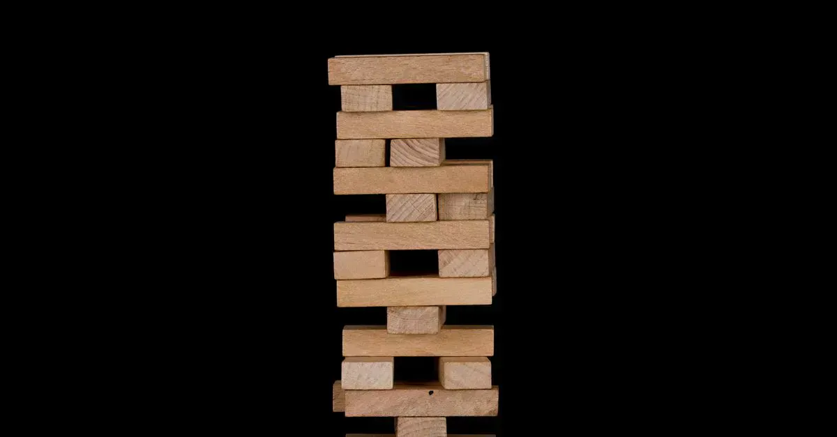 Giant Jenga set on a lawn, ready to play